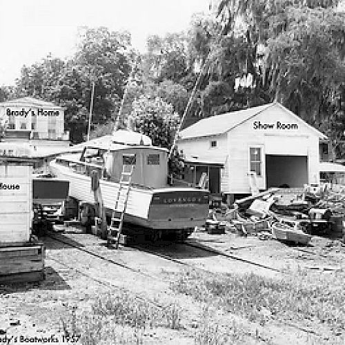 The image shows a boatyard with several labeled buildings, including 