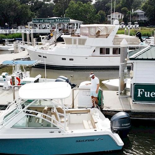 The image shows a marina with boats docked, a building labeled 